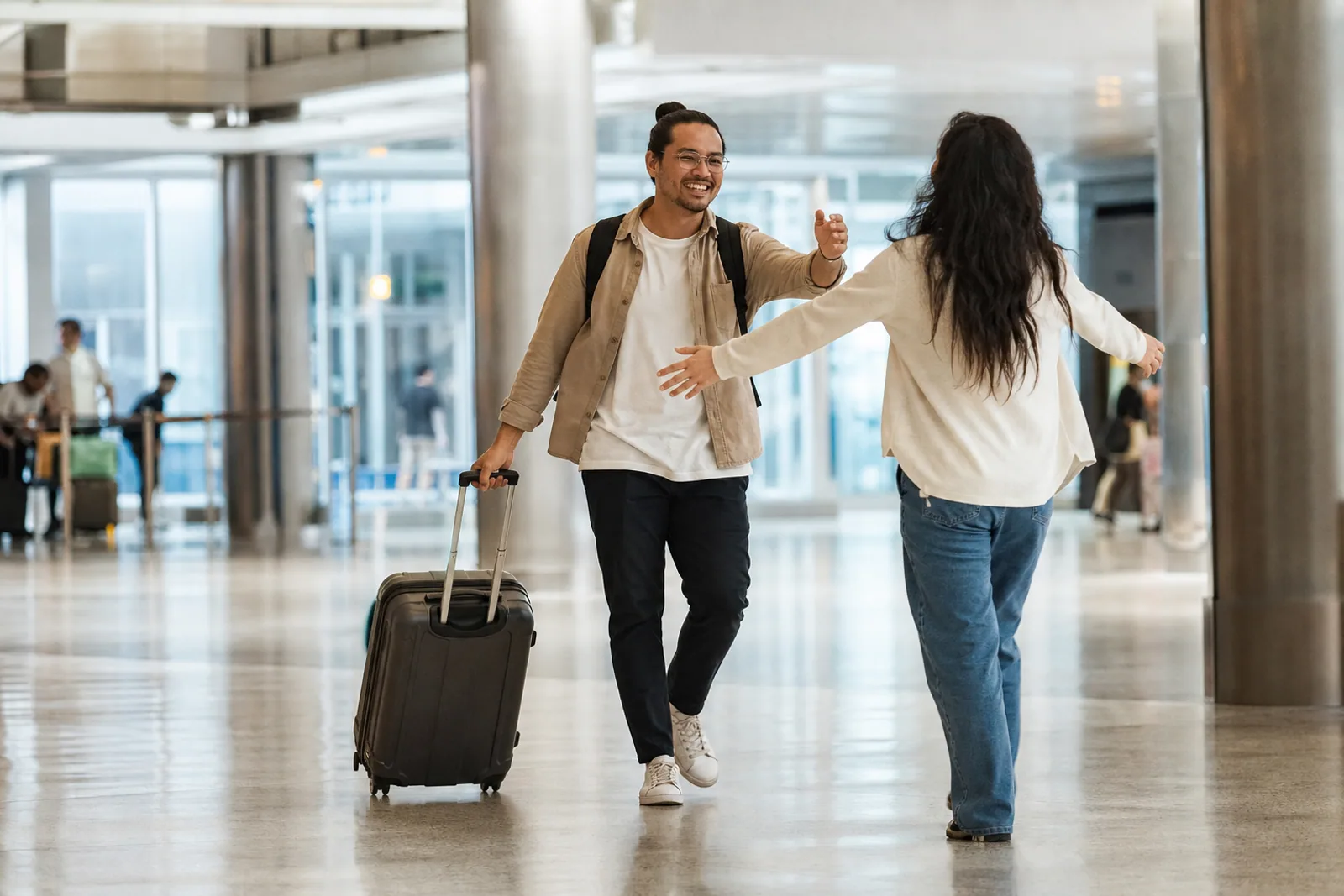 A permanent resident being welcomed home at an airport