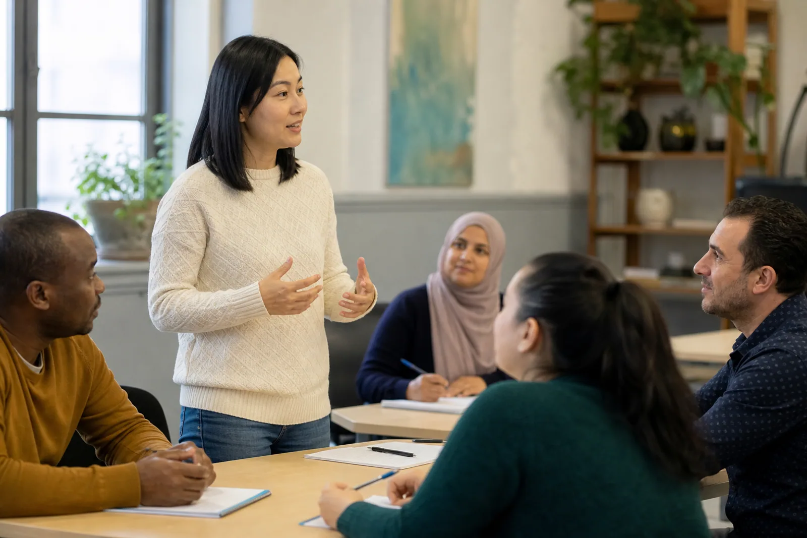 Adult students participating in a language class